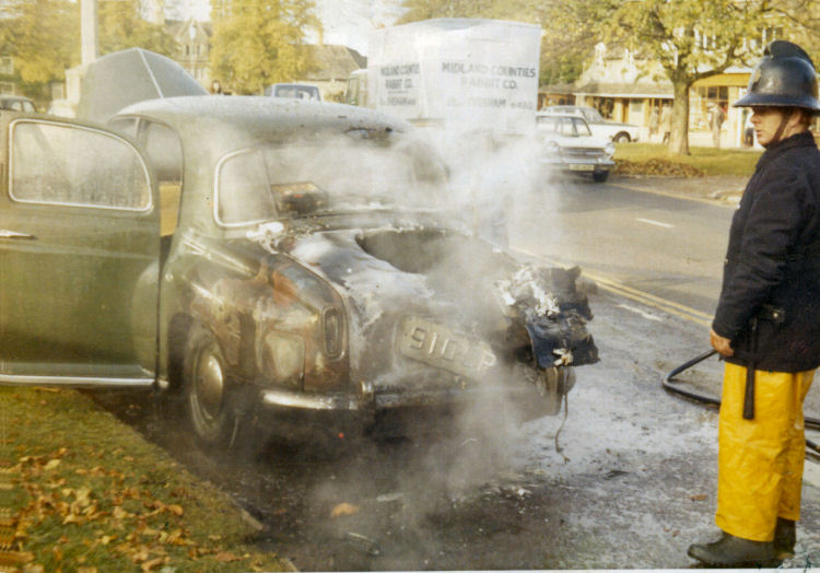 Les Barnett by the burnt out car