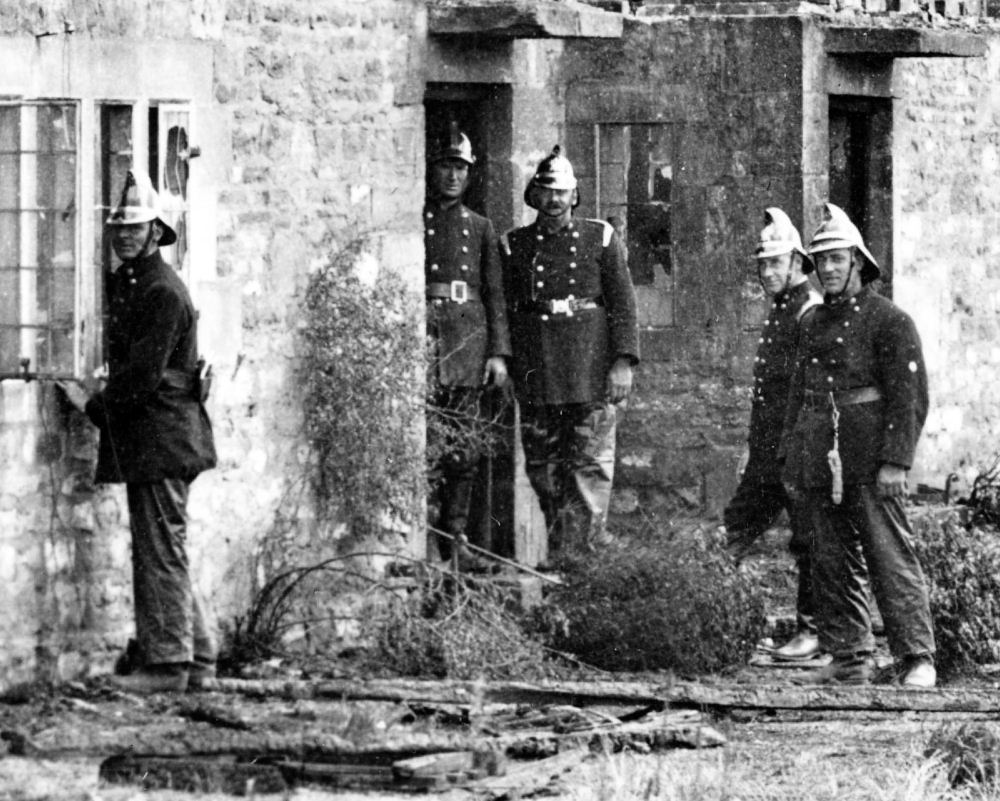 Close up of firemen at Russells Cottages fire 1934