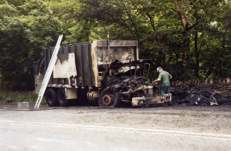 The burnt out dust cart