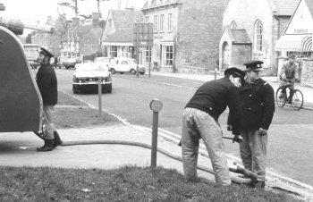 Pat Malin, John Arnold and Les Barnet filling the appliance with water 1976 